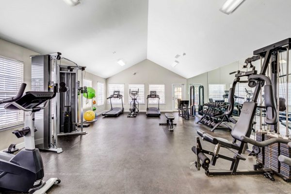 Spacious fitness center with various cardio and strengthening equipment